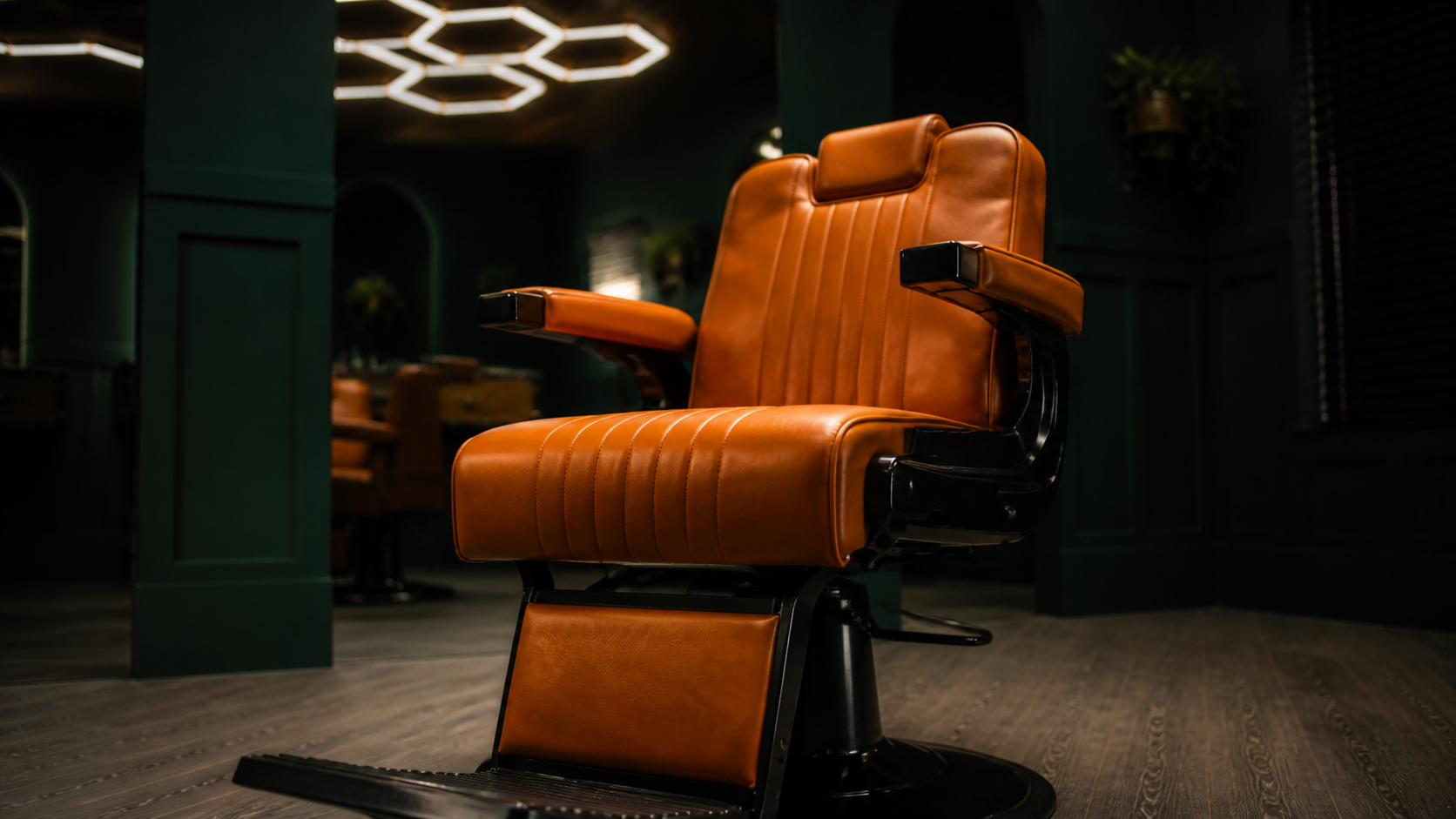 Barber chair at JM Barber Co., Lake Park, FL Orange leather barber chair in the JM Barber Co. studio in Lake Park, Florida
