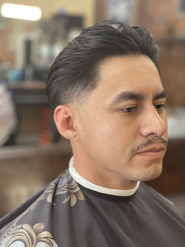Low taper haircut — JM Barber Co., Lake Park, Florida Low taper haircut with swept-back finish at JM Barber Co. in Lake Park, FL